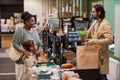 Black young mother with little girl buying groceries in supermarket Royalty Free Stock Photo