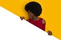 Black Young Woman Behind White Banner Looking Down Royalty Free Stock Photo