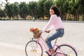 Black young woman riding a vintage bicycle Royalty Free Stock Photo