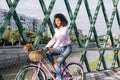 Black young woman riding a vintage bicycle Royalty Free Stock Photo