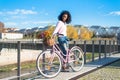 Black young woman riding a vintage bicycle Royalty Free Stock Photo