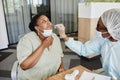 Woman Letting Doctor to Take Nasal Swab