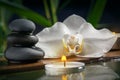 Black zen stones,candles and white orchids on a wooden plank on the surface of the water. SPA, relaxation, meditation Royalty Free Stock Photo