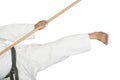 Blackbelt Karate giving a kick with the bo Royalty Free Stock Photo