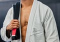 . Blackbelt karate, taekwondo body martial arts master and experienced fighter teaches self defense in dojo close up