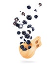 Blackberries fly out from a wooden cup on a white background Royalty Free Stock Photo