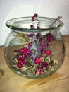 Blackberries, Holly, Rosehip And Grasses In Glass Vase Decorated Autumnally