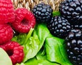 Blackberries, raspberries and spinach in the foreground.