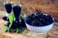 Blackberry fruit liqueur in two shot glasses with berries and gr Royalty Free Stock Photo