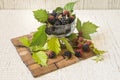 BlackBerry in a glass on the table close-up. blackberries on a wooden background