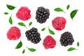 Blackberry and raspberry with leaves isolated on white background. Top view. Flat lay pattern Royalty Free Stock Photo