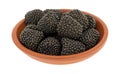 Blackberry shaped candy in a small bowl Royalty Free Stock Photo