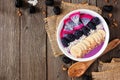 Blackberry smoothie bowl, corner border on a wood background Royalty Free Stock Photo