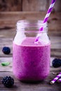 Blackberry smoothie in a mason jar on a wooden background Royalty Free Stock Photo