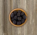 Blackberry in a wooden bowl. Top view.