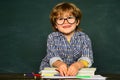 Blackboard background. Little children at school lesson. Kids from primary school. School kids. Schoolboy. Learning