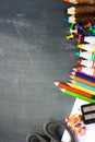 Blackboard background with school supplies suggesting back to school season Royalty Free Stock Photo