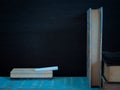 Blackboard and books. Royalty Free Stock Photo