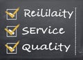 Blackboard with a checklist Reliability, Service and Quality Royalty Free Stock Photo