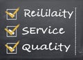 Blackboard with a checklist Reliability, Service and Quality