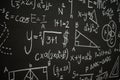 Blackboard inscribed with scientific formulas and calculations in physics, mathematics and electrical circuits. Science and Royalty Free Stock Photo