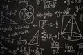 Blackboard inscribed with scientific formulas and calculations in physics, mathematics and electrical circuits. Science and Royalty Free Stock Photo