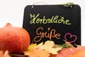 A blackboard with the inscription autumn greetings in german language