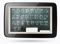 Blackboard inside computer tablet with sketchy alphabet Royalty Free Stock Photo