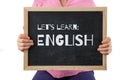 Blackboard with Let`s Learn English text. Royalty Free Stock Photo