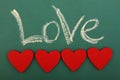 Blackboard love with four hearts