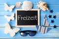 Blackboard With Maritime Decoration, Freizeit Means Leisure Time Royalty Free Stock Photo