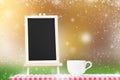 Blackboard menu with coffee cup display on fabric tabletop with Royalty Free Stock Photo