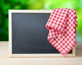 Blackboard menu recipe frame picnic cloth background. Royalty Free Stock Photo