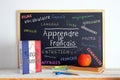 Blackboard with the message LEARN FRENCH