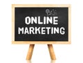 Blackboard with Online marketing word and icon on white background ,Business concept Royalty Free Stock Photo