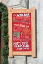 Blackboard outside an open italian restaurant and menu