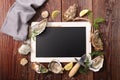 Blackboard with oyster, lemon and dill