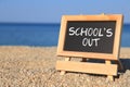 Blackboard with School's out text Royalty Free Stock Photo