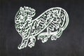 Shiite Calligraphy symbolising Ali as Tiger of God drawn on a blackboard