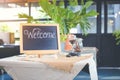 Blackboard sign with welcome message in coffee shop Royalty Free Stock Photo