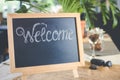 Blackboard sign with welcome message in coffee shop Royalty Free Stock Photo