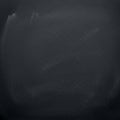 A blackboard with a slightly dusty surface, showing signs of previous chalk use. The Royalty Free Stock Photo