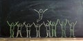 A blackboard with figures in chalk Celebrating success. People throw the winner up created with Generative AI technology Royalty Free Stock Photo