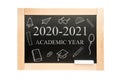 Blackboard with the text academic year 2020 2021 and drawings with school supplies Royalty Free Stock Photo