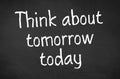 Blackboard with the text Think about tomorrow today Royalty Free Stock Photo