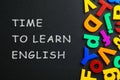 Blackboard with text Time o Learn English and plastic letters Royalty Free Stock Photo