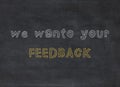 Blackboard with the text We want your feedback