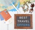 blackboard with text & x22;Best travel offers& x22;, plane, map, passport, money, sunglasses