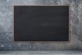 Blackboard texture. Empty blank black chalkboard with chalk traces Concrete wall, cement background. Royalty Free Stock Photo