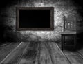 Blackboard and wood chair in interior room with gray wooden wall Royalty Free Stock Photo